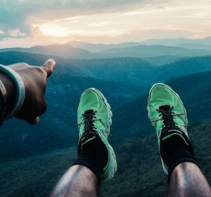 person wearing pair of green shoes